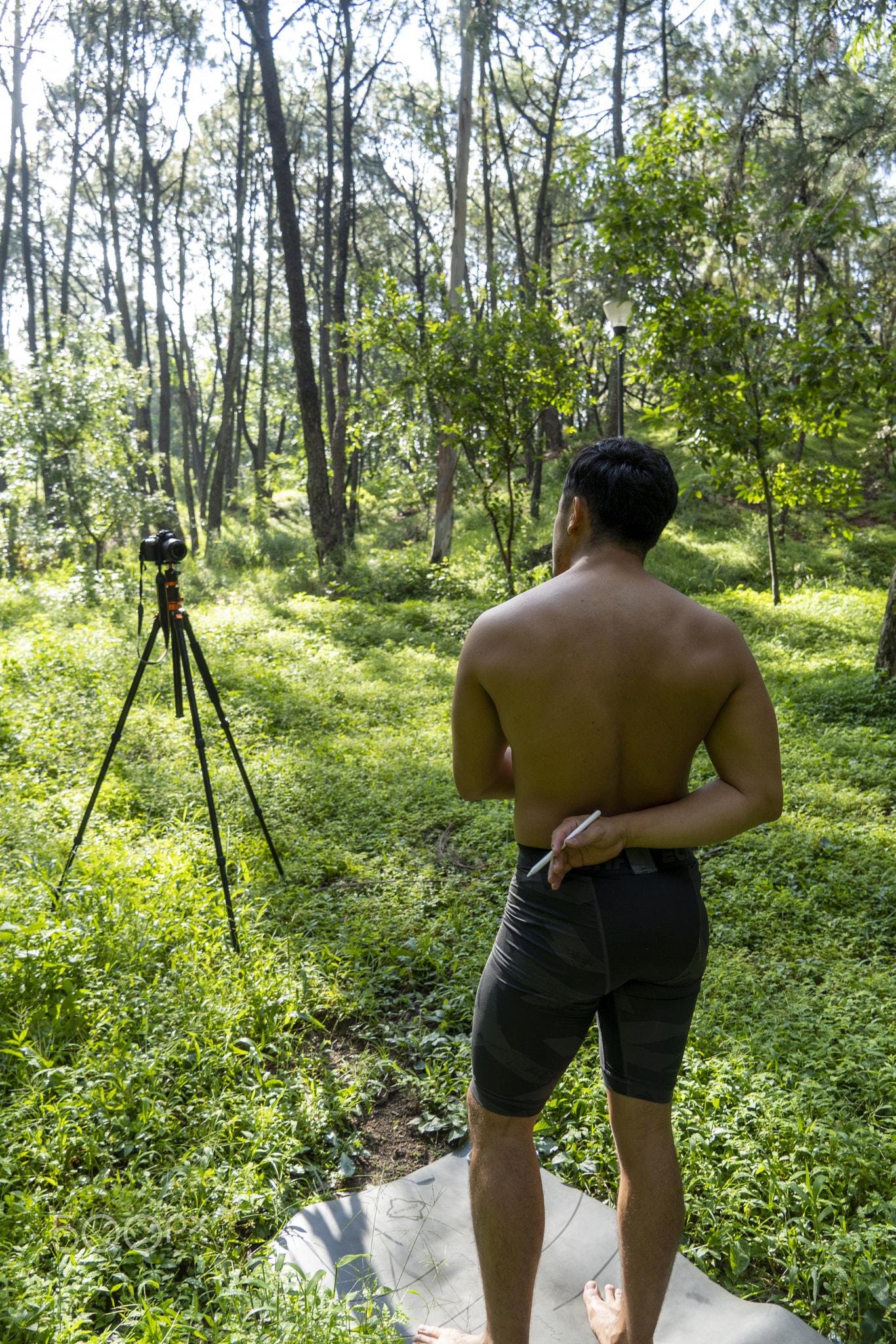 Guy with tablet making video blog on phone. Isolated person giving