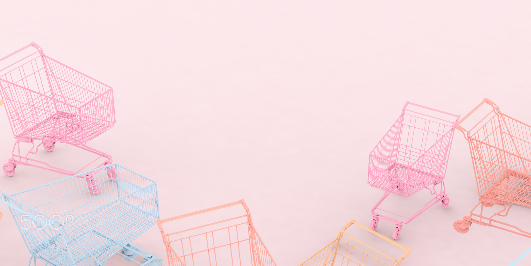 Banner of different pastel colored shopping carts on pink background