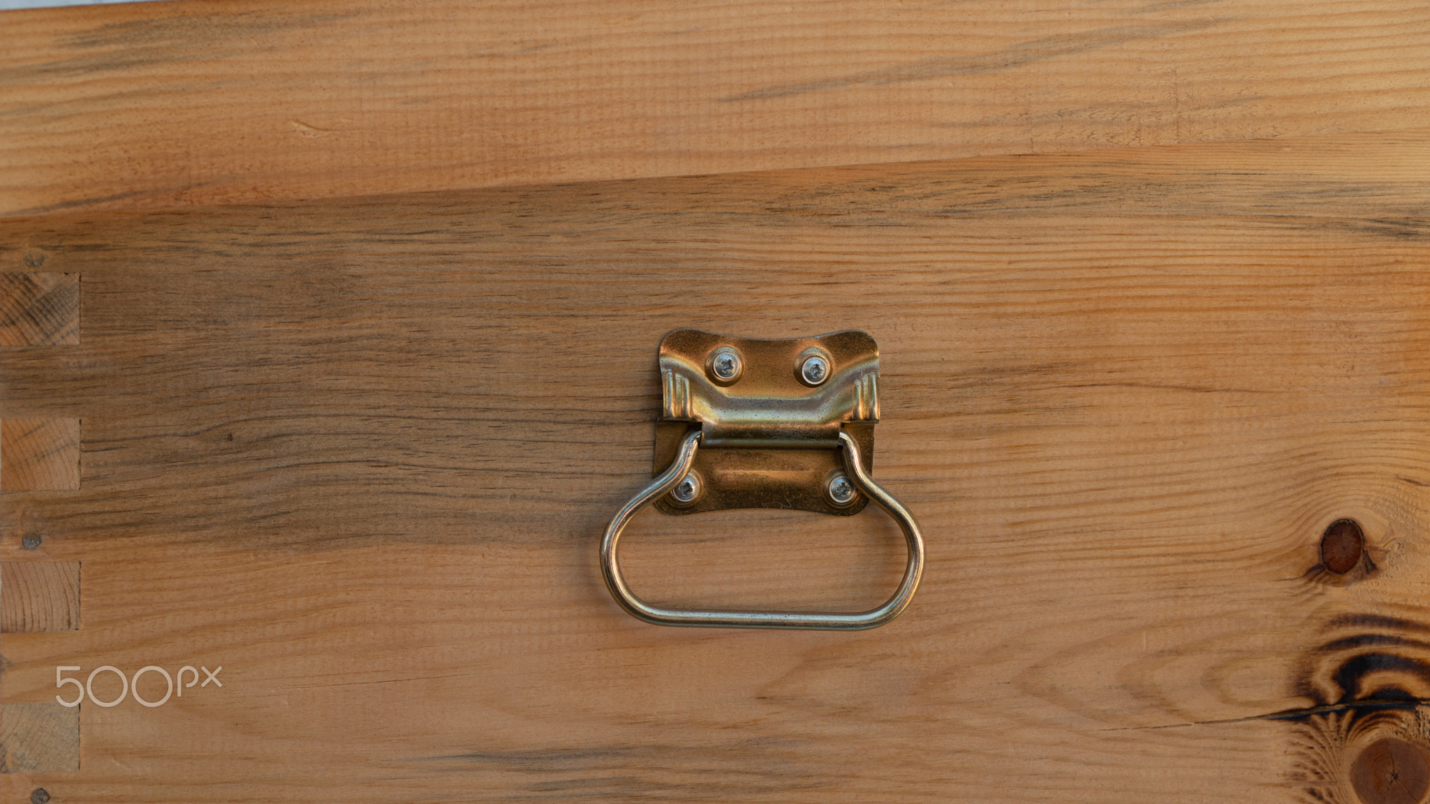Wooden background with metal handle