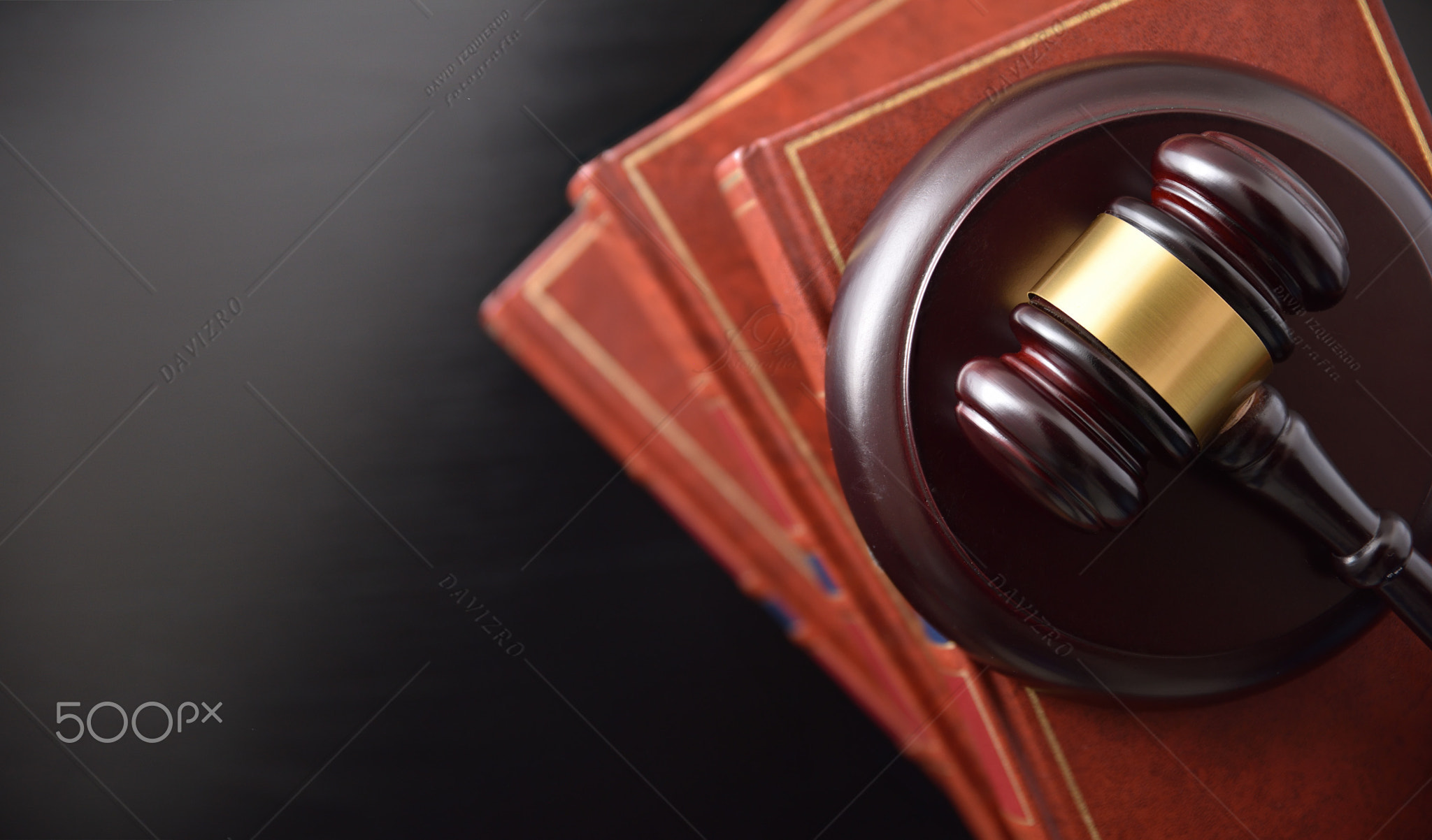 Pile of law books and gavel on top