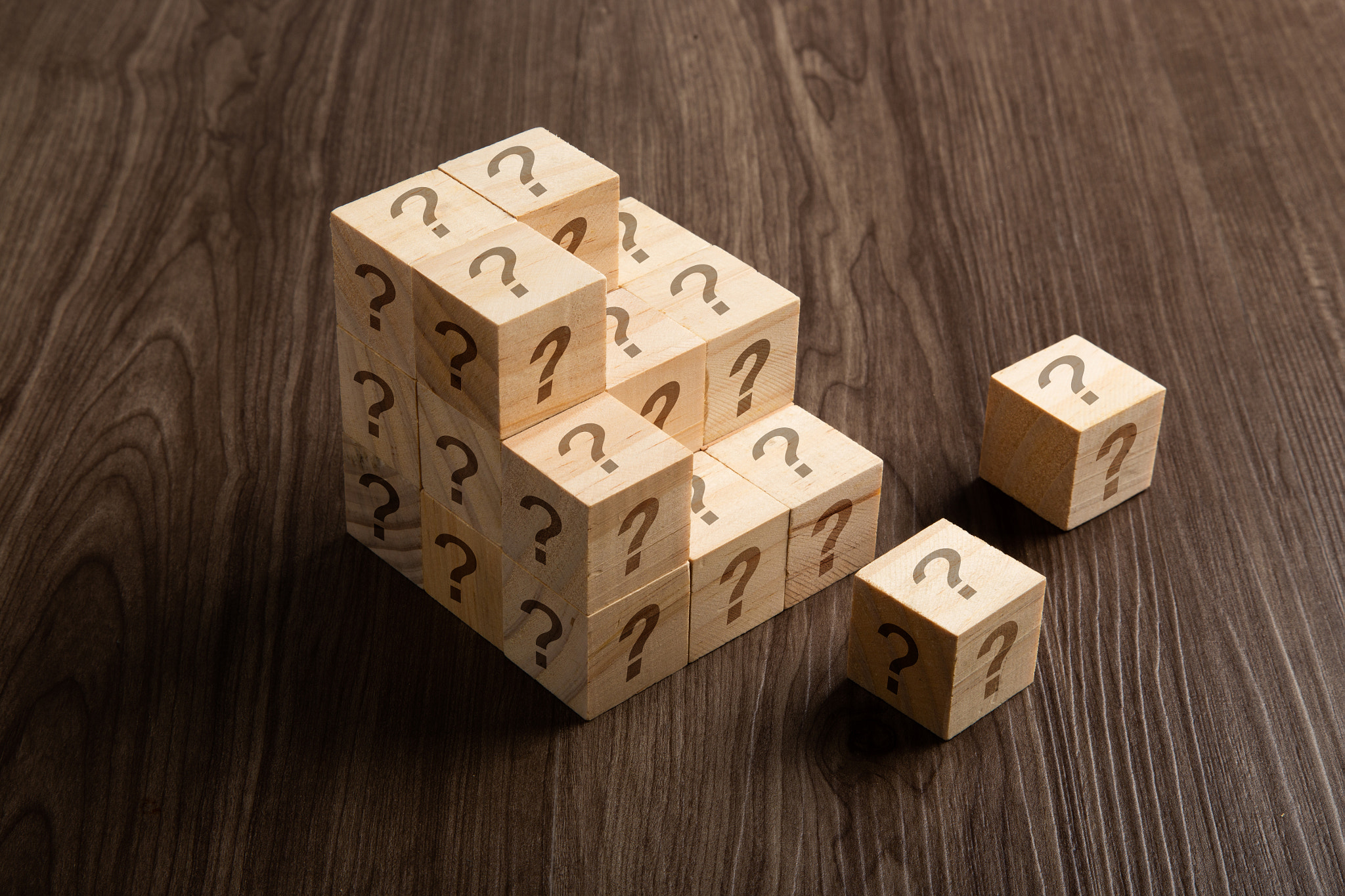 Financial business concept. Question marks on wooden blocks