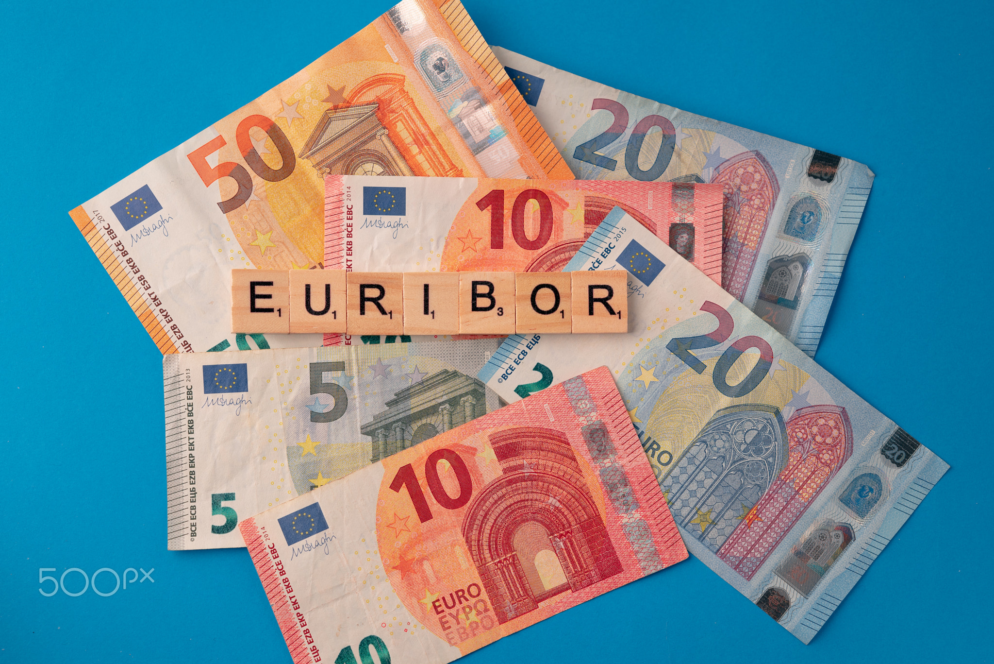 Word EURIBOR Is Written In Wooden Letters On Background Of Euro
