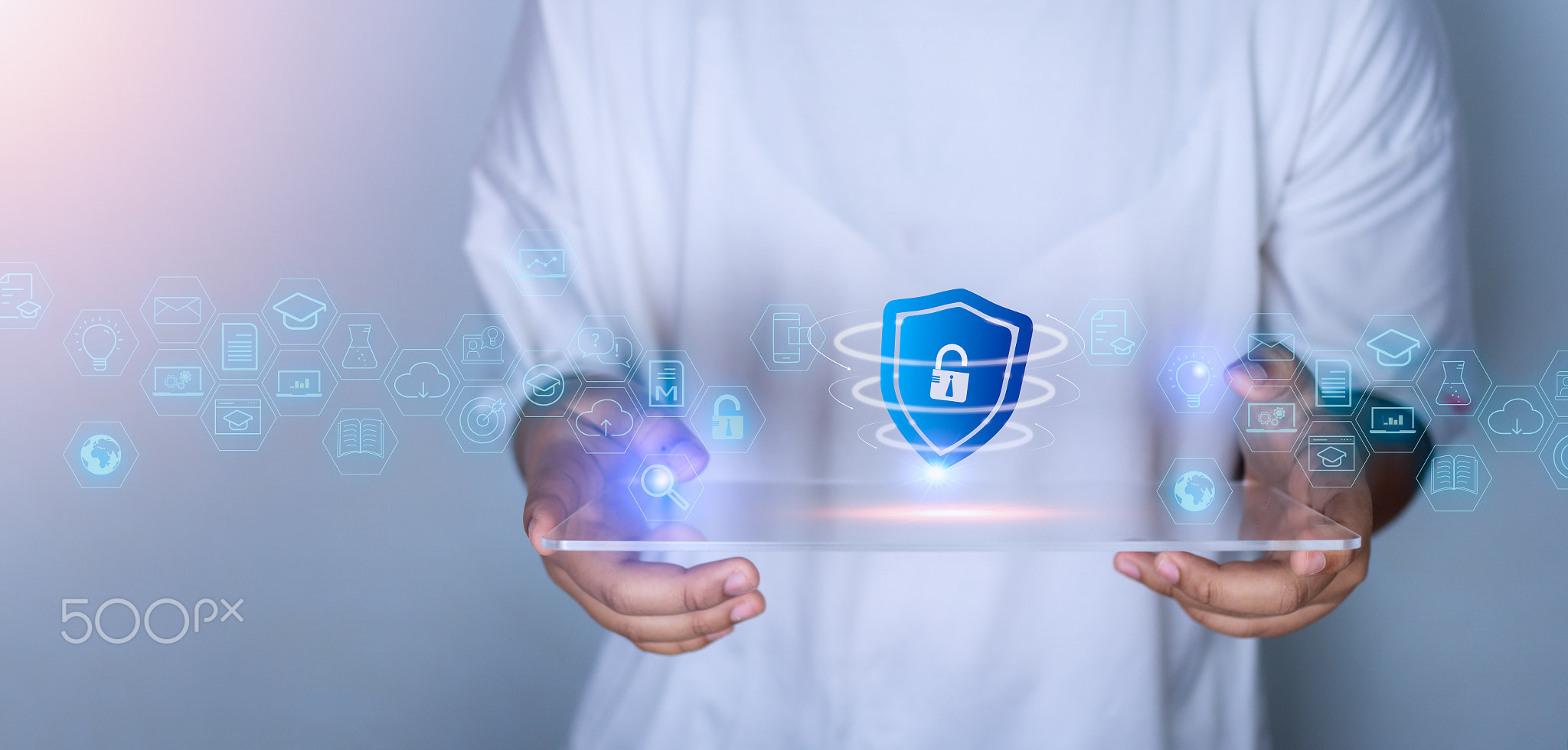 Woman holding phone tablet screen with protection icon. Represents protection against external hacks