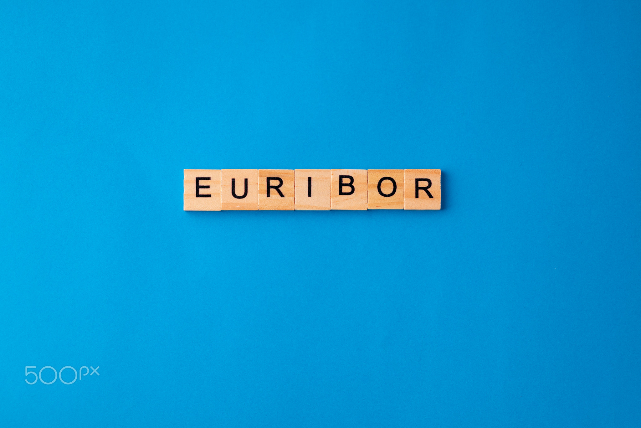 Word EURIBOR Is Written In Wooden Letters On Blue Background. Copy