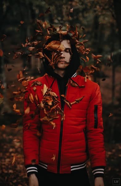 Young man standing in forest during autumn by Lana Wayne on 500px.com