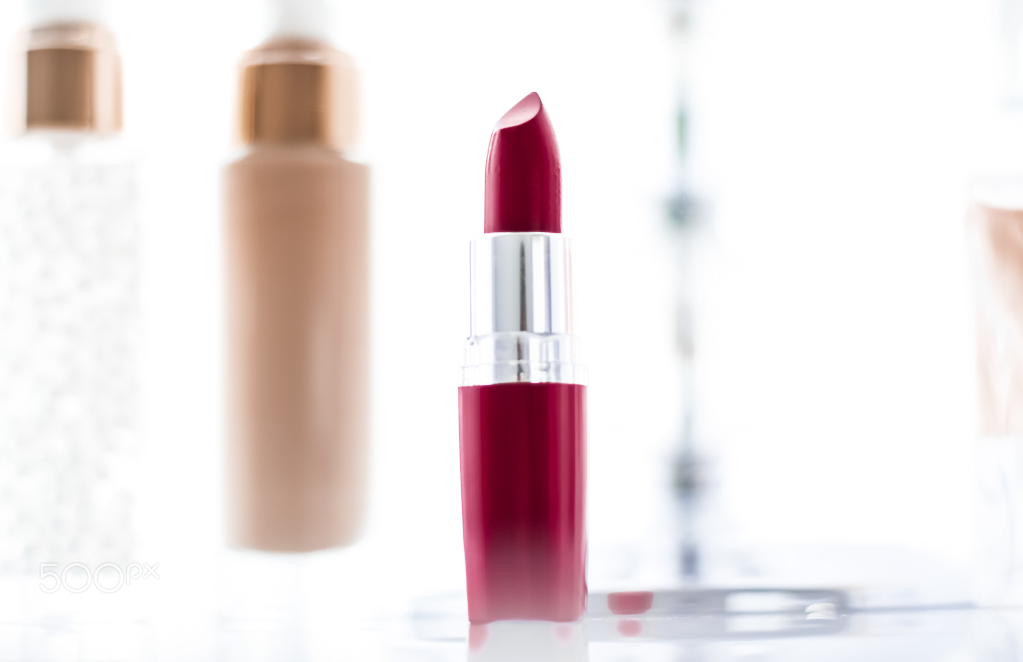 Cosmetics, makeup products on dressing vanity table, lipstick