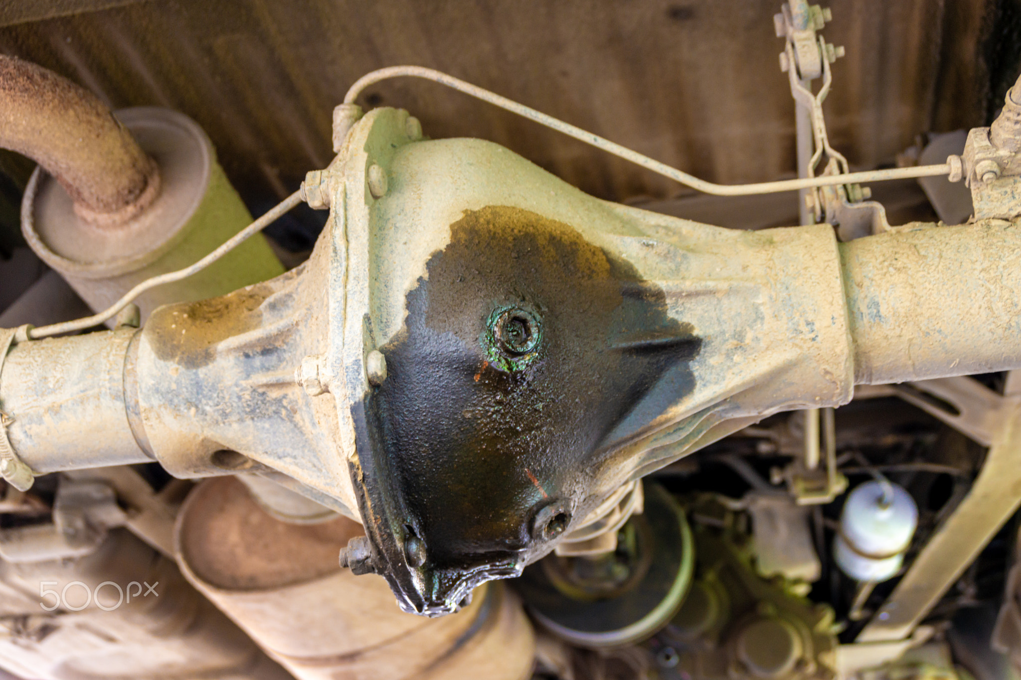 grease leaks from the rear axle drive of the car, which causes the