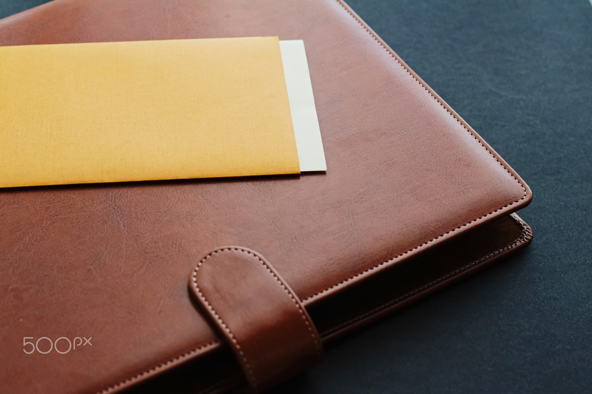 Office desk with briefcase and business card, finance and economy