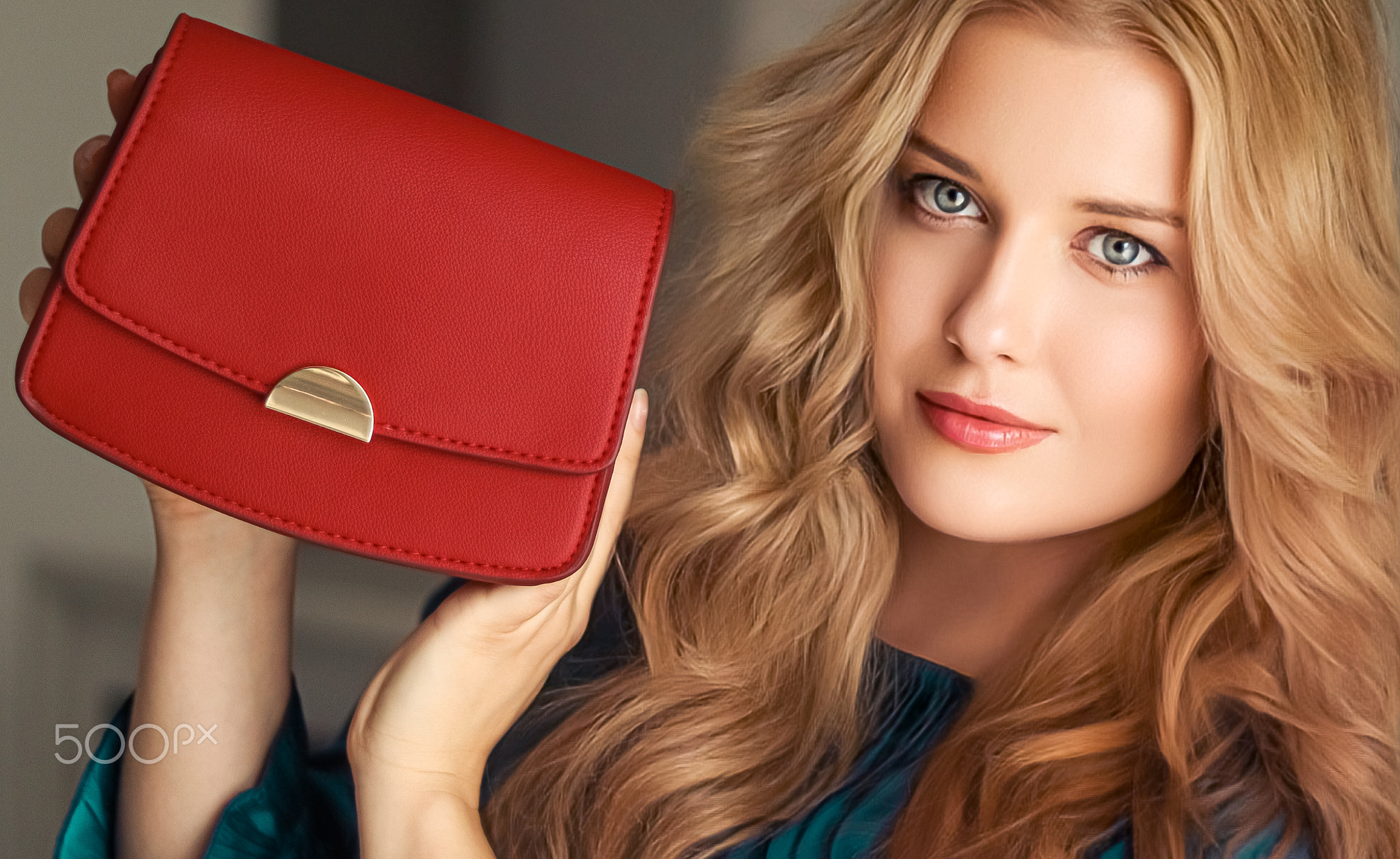 Fashion and accessories, happy beautiful woman holding small red