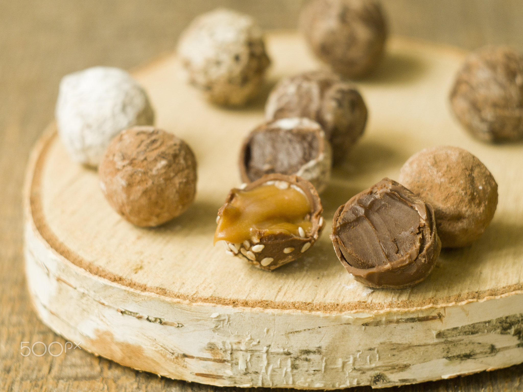 Homemade chocolate candy truffles glazed with chocolate ganache on a