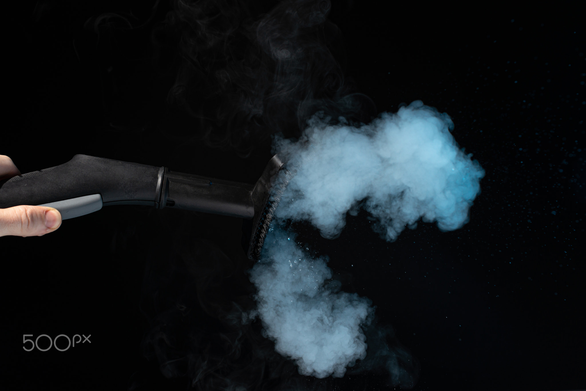 steam cleaner for cleaning the house, steam erupts from the brush.