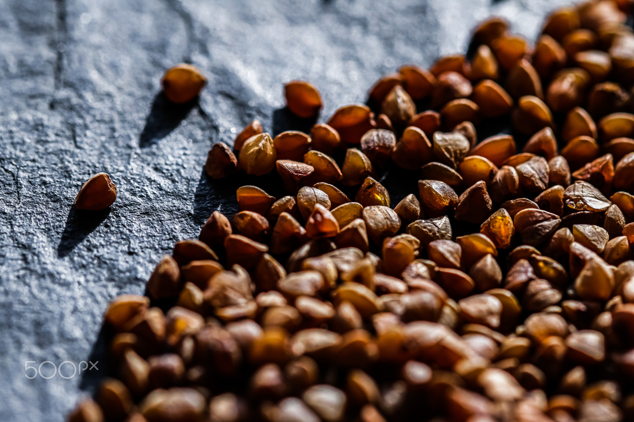 Buckwheat grain closeup, food texture and cook book background