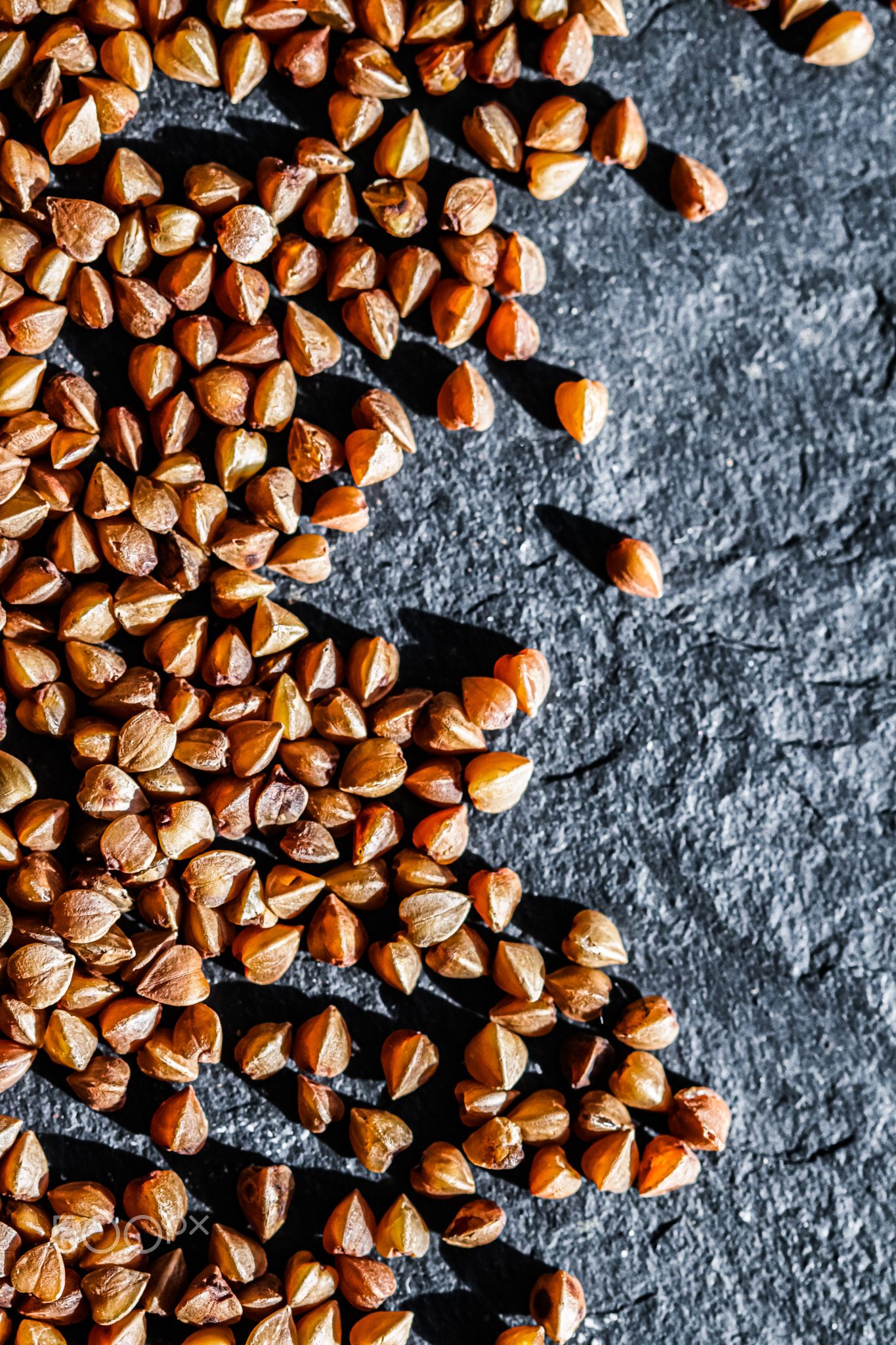 Buckwheat grain closeup, food texture and cook book background