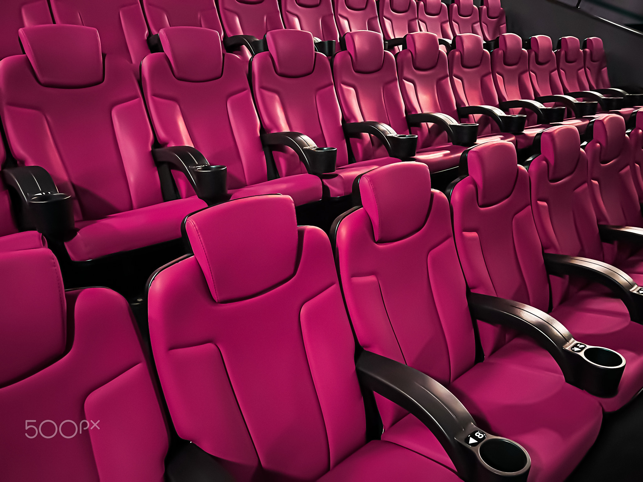 Cinema and entertainment, empty pink movie theatre seats for tv show