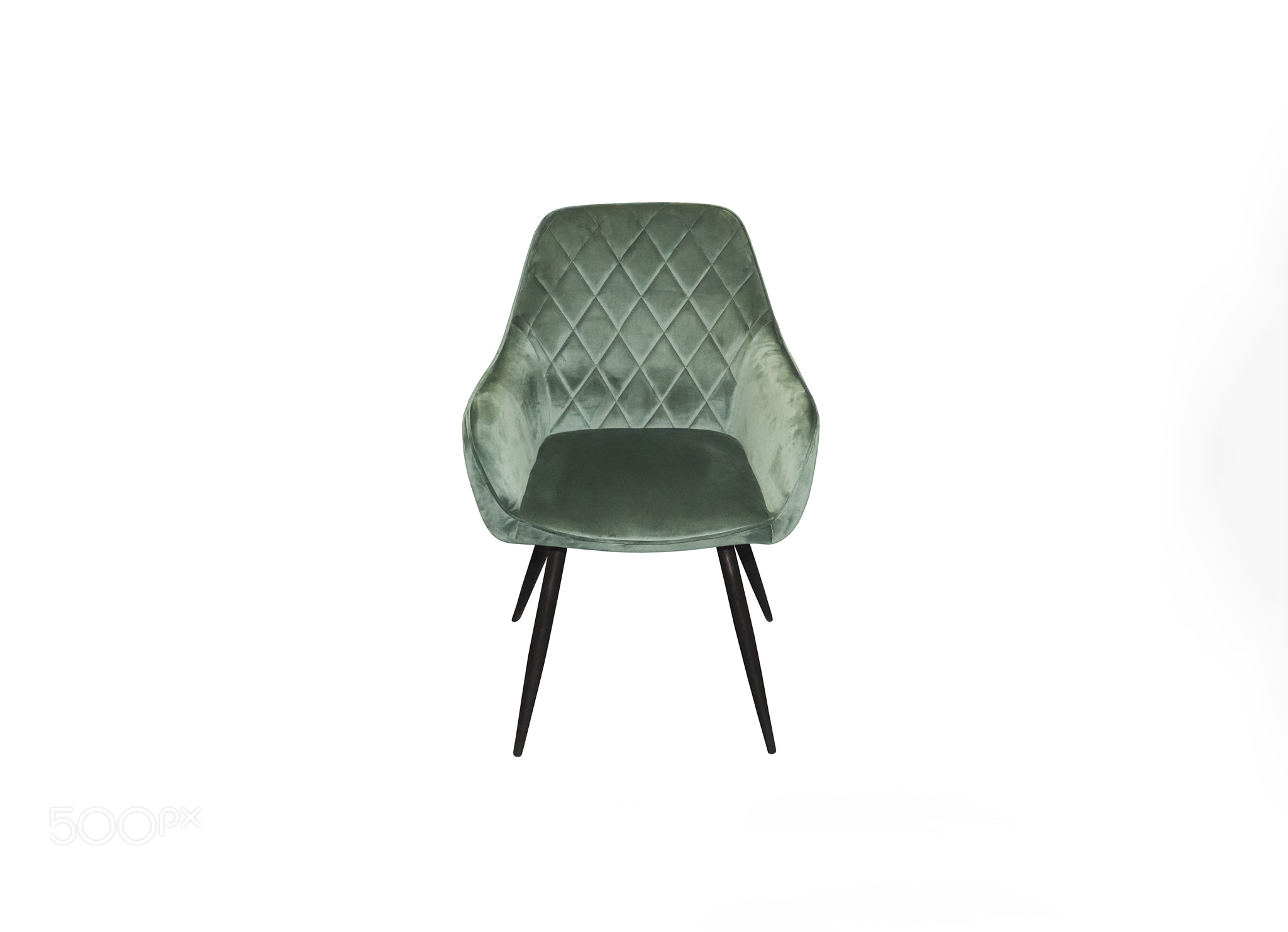 Comfortable velours green armchair on white background. Interior 