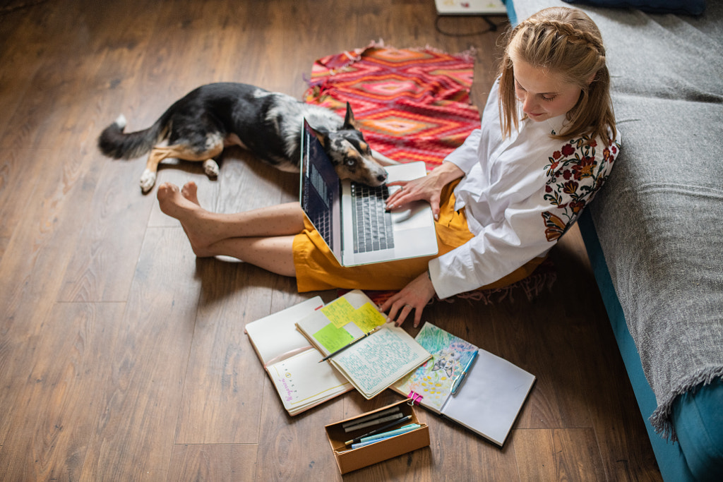 Young girl with laptop computer and dog by Iza ?yso? on 500px.com