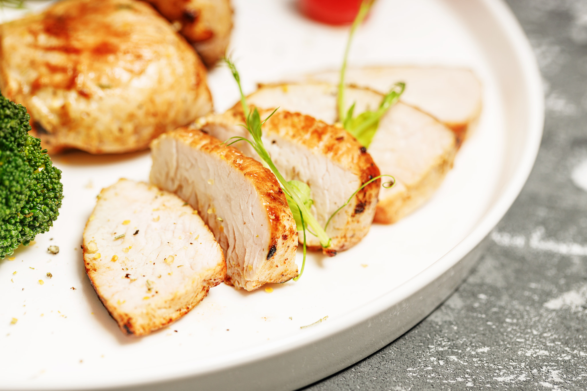 Close-up Turkey breast meat and broccoli on a white plate. Delicious and healthy food.