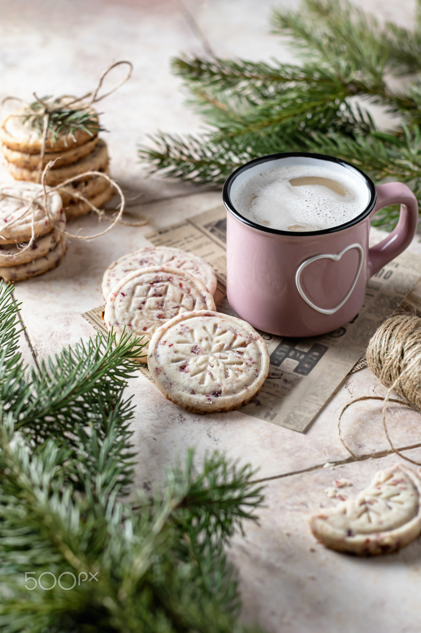 Cranberry cookies with cup of coffee . Christmas decoration with fir