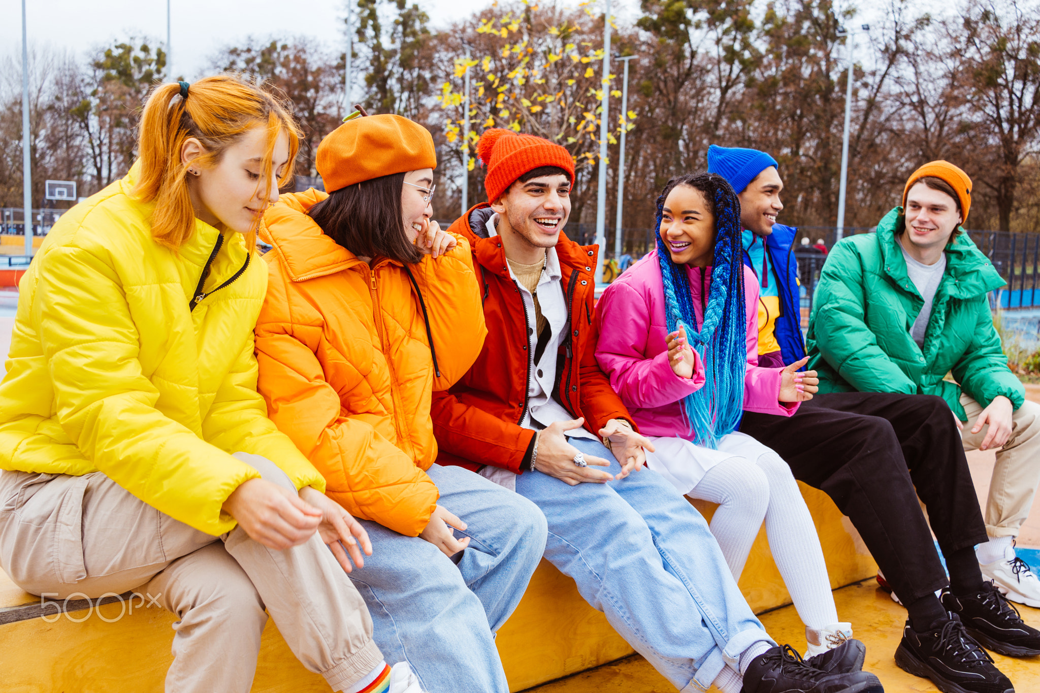 Multiracial group of young friends meeting outdoors in winter