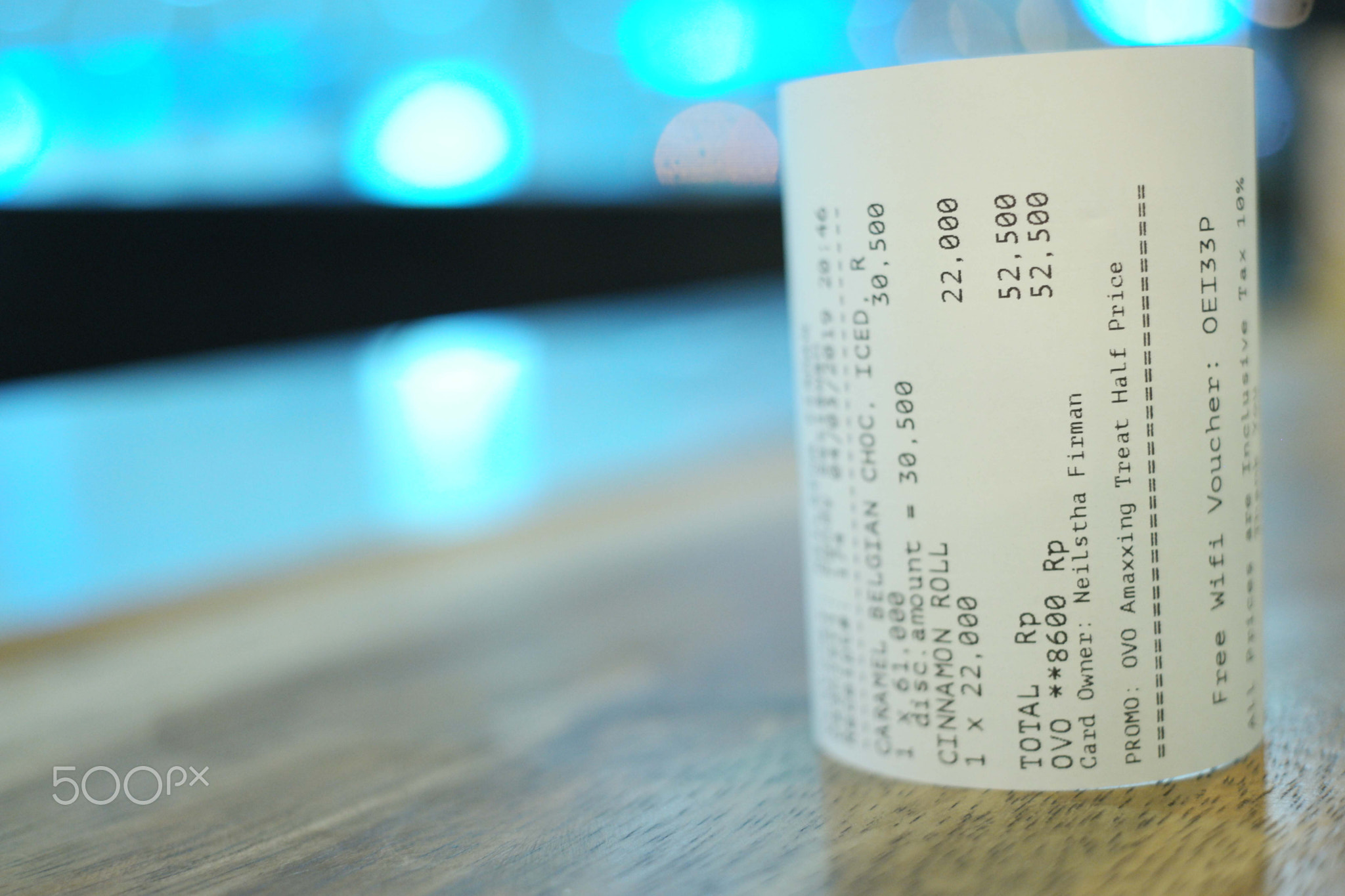 Grocery shopping roll printout on a wooden table