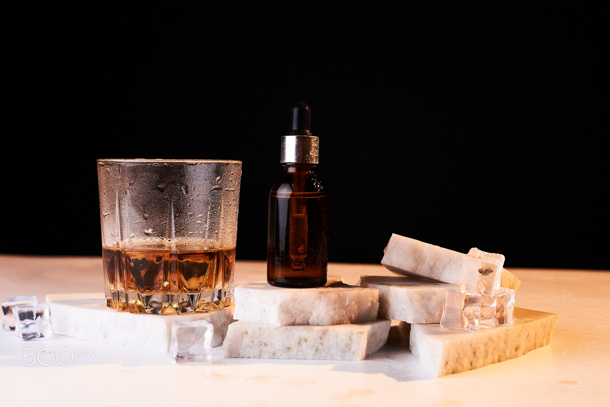 Beard oil with whiskey on a white background