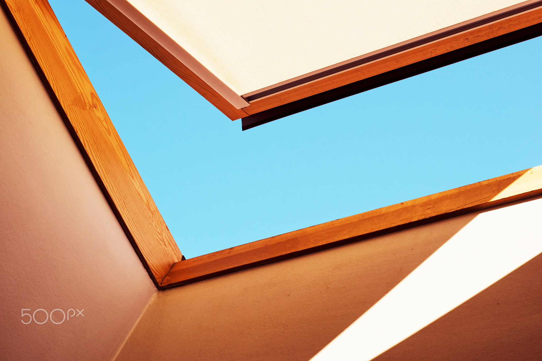 Open skylight with a piece of blue sky