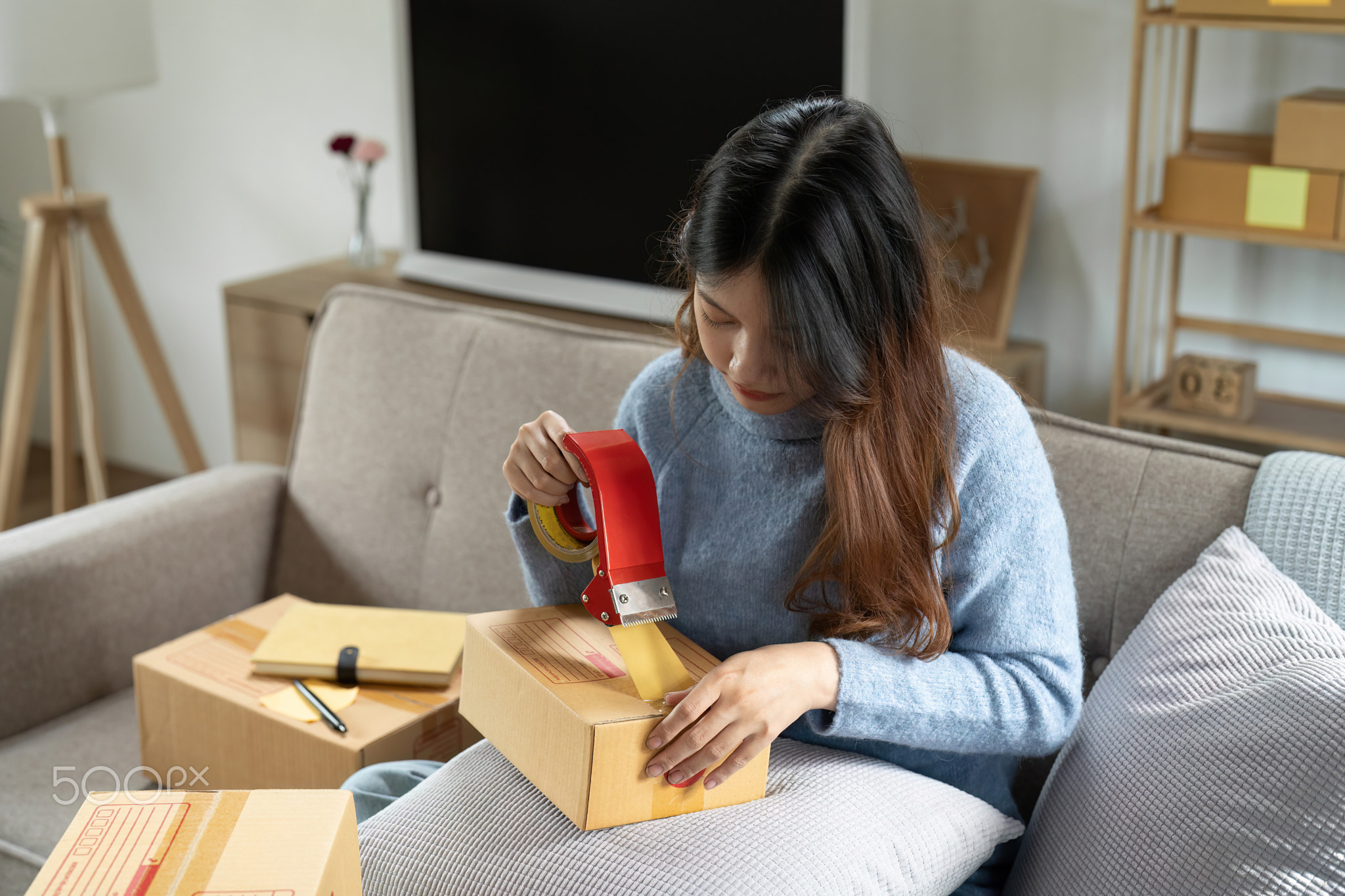 Startup small business, Young woman working freelance and packing box