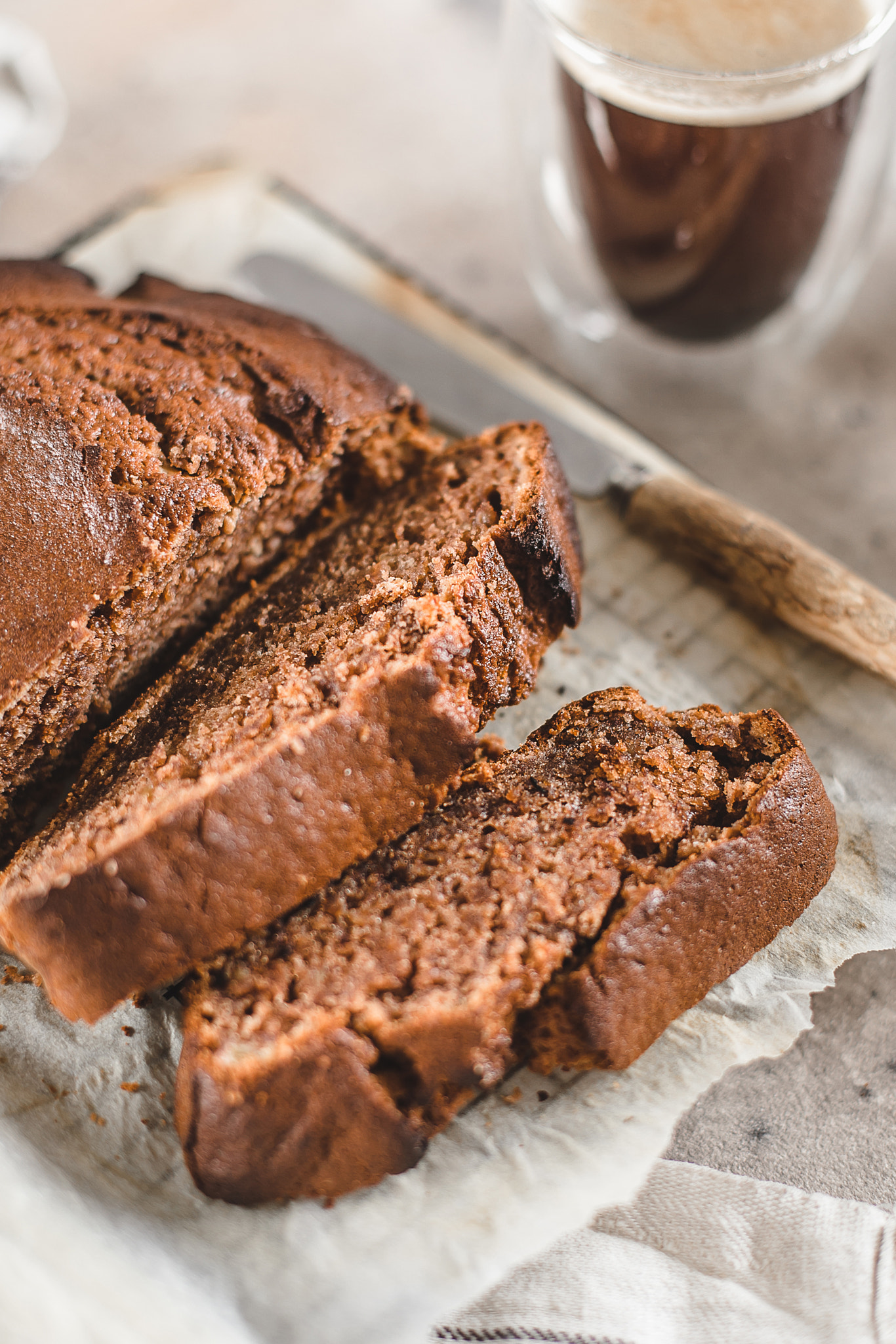 Banana bread sliced with coffee. Home bakery concept.