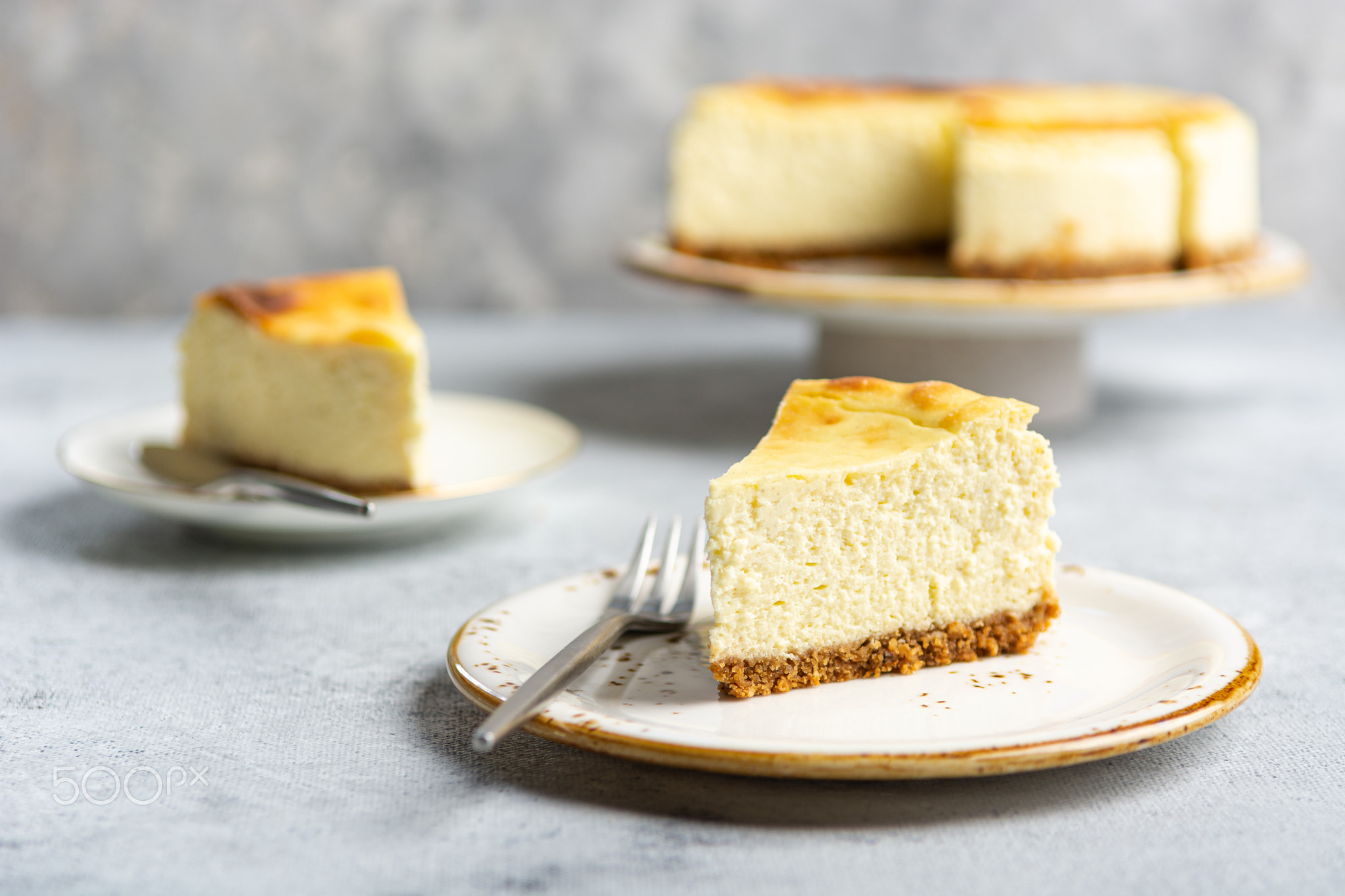 Cottage cheese casserole on shortbread on a white ceramic plate on a