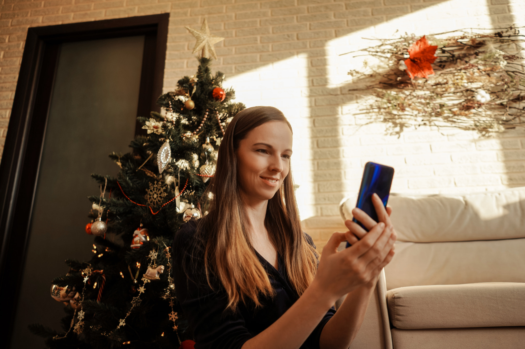 Happy woman looking at phone and smile.