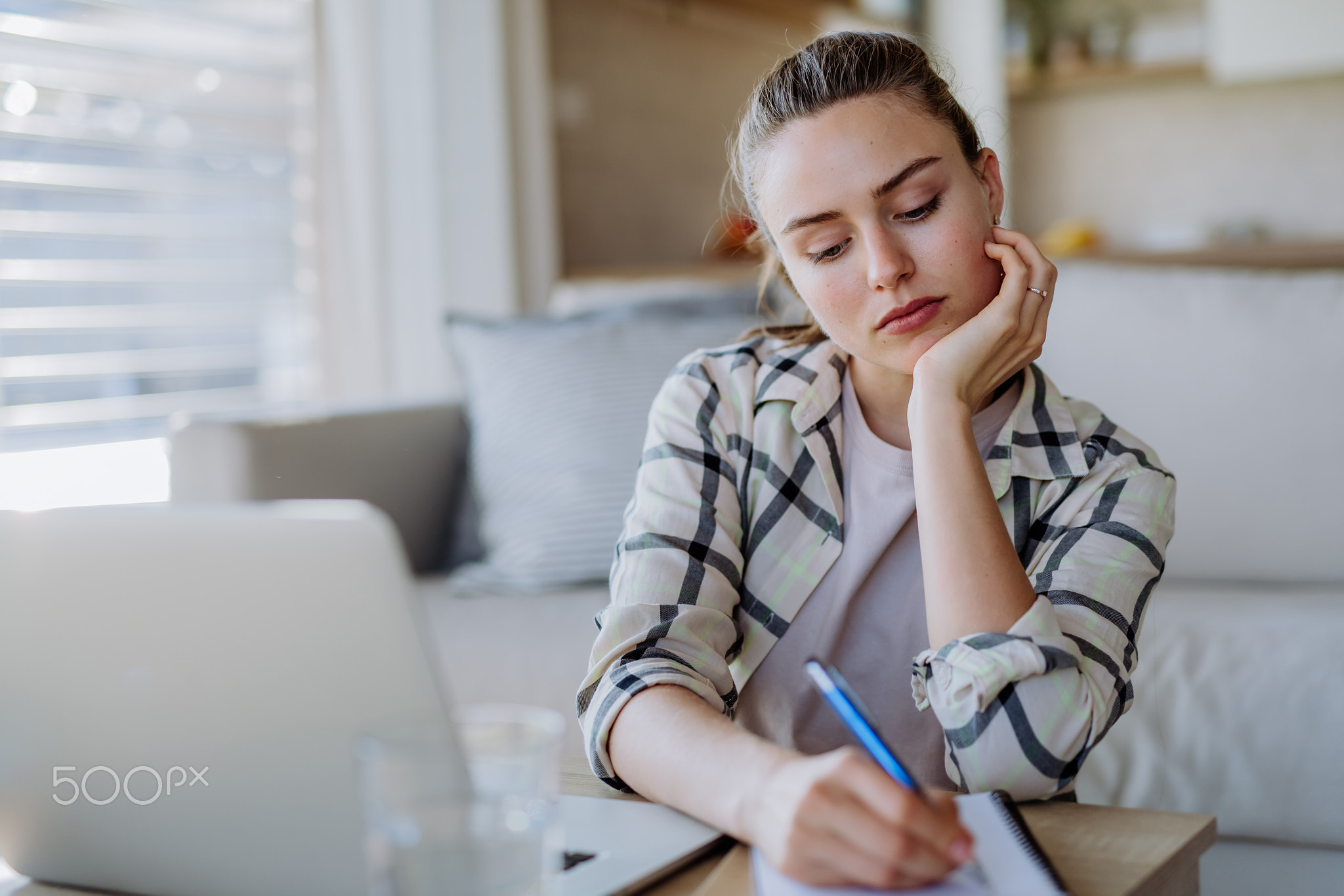 Young woman having homeoffice in her apartment.