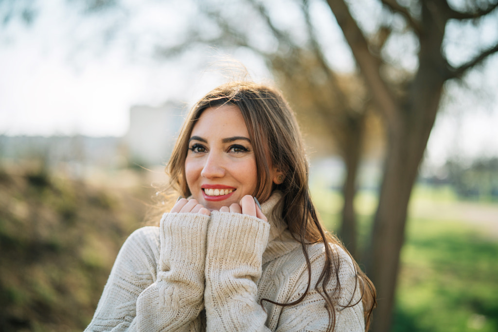 Portrait of smiling young woman in the park by Olha Dobosh on 500px.com