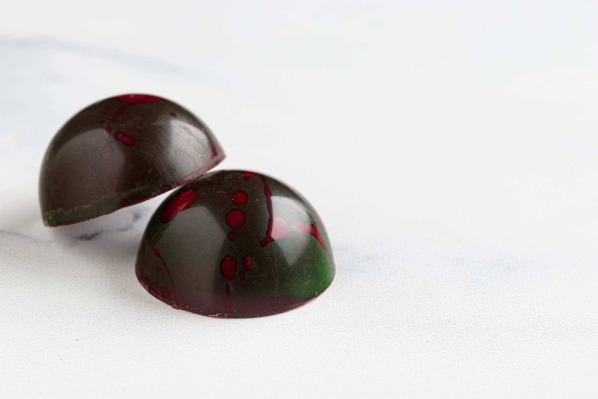 Painted handcrafted chocolate bonbons. Delicious dessert