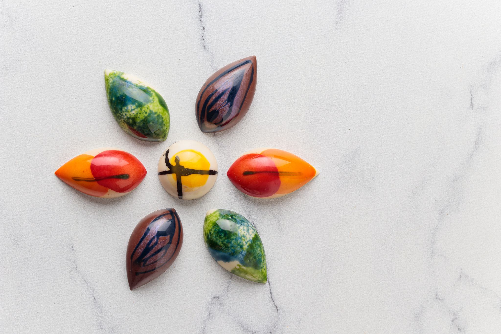 Assortment of painted handcrafted chocolate bonbons. Delicious dessert