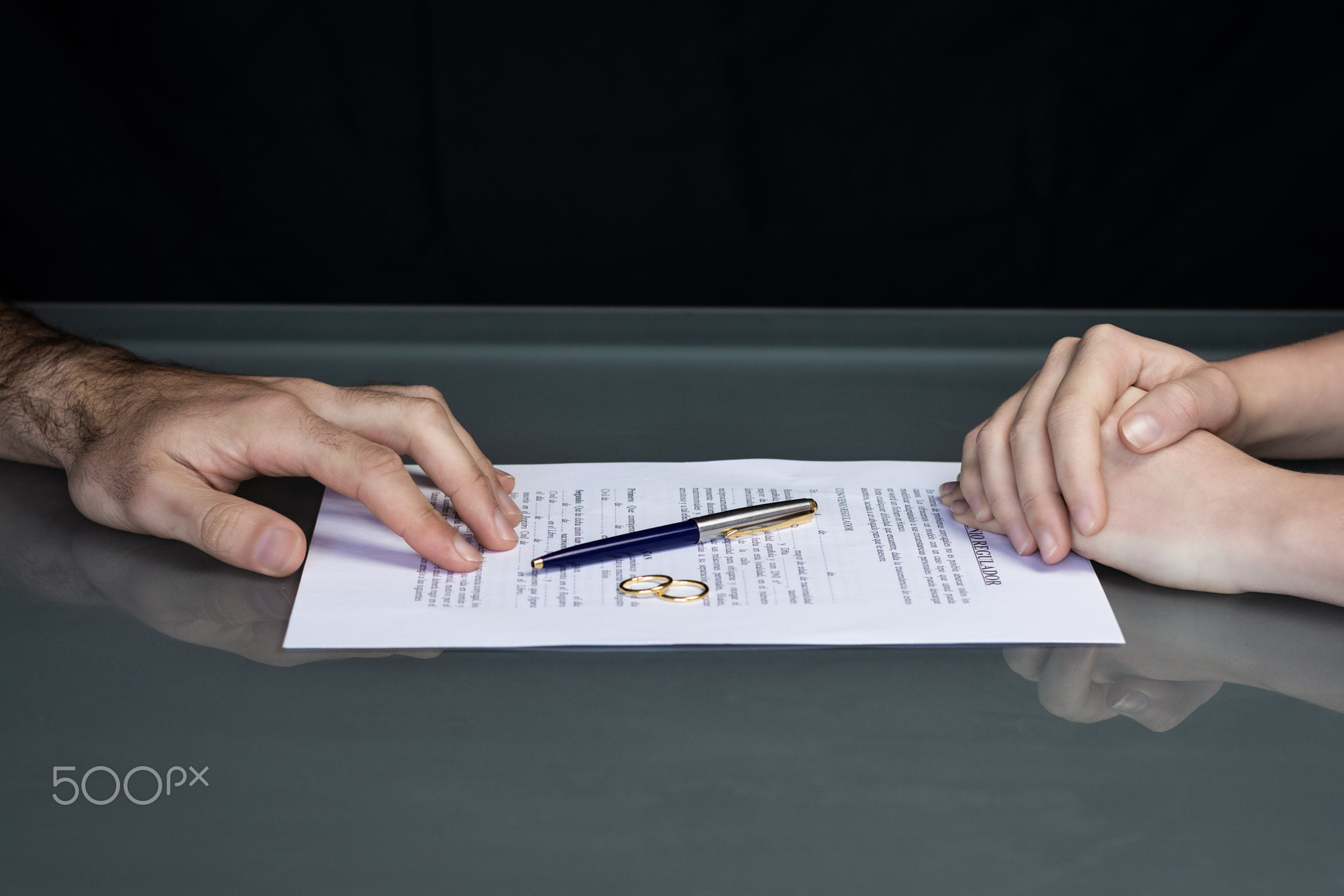 Couple goes through divorce signing papers