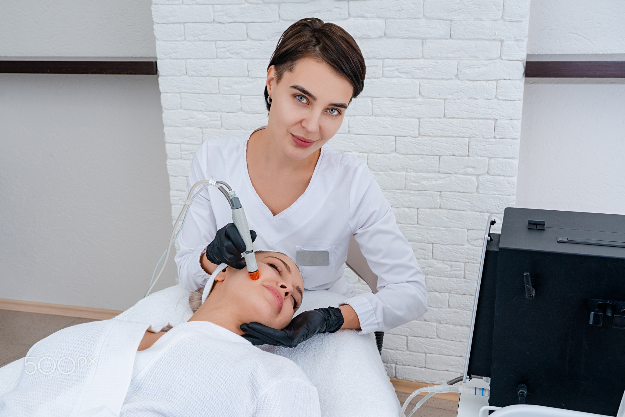 Face Skin Care. Closeup Of Woman Face Cleansing At Cosmetology clinic