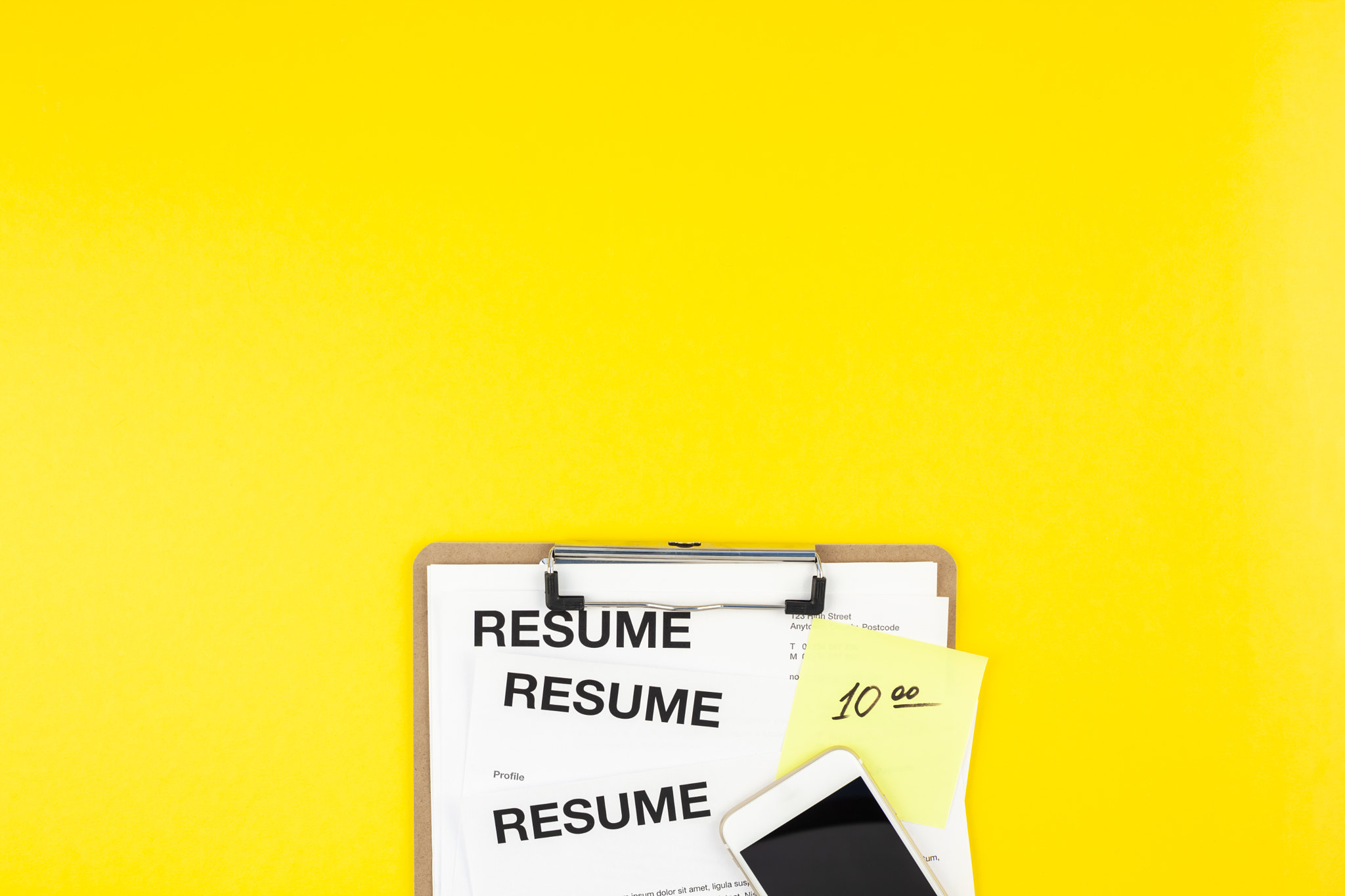 We are hiring flat lay on yellow background