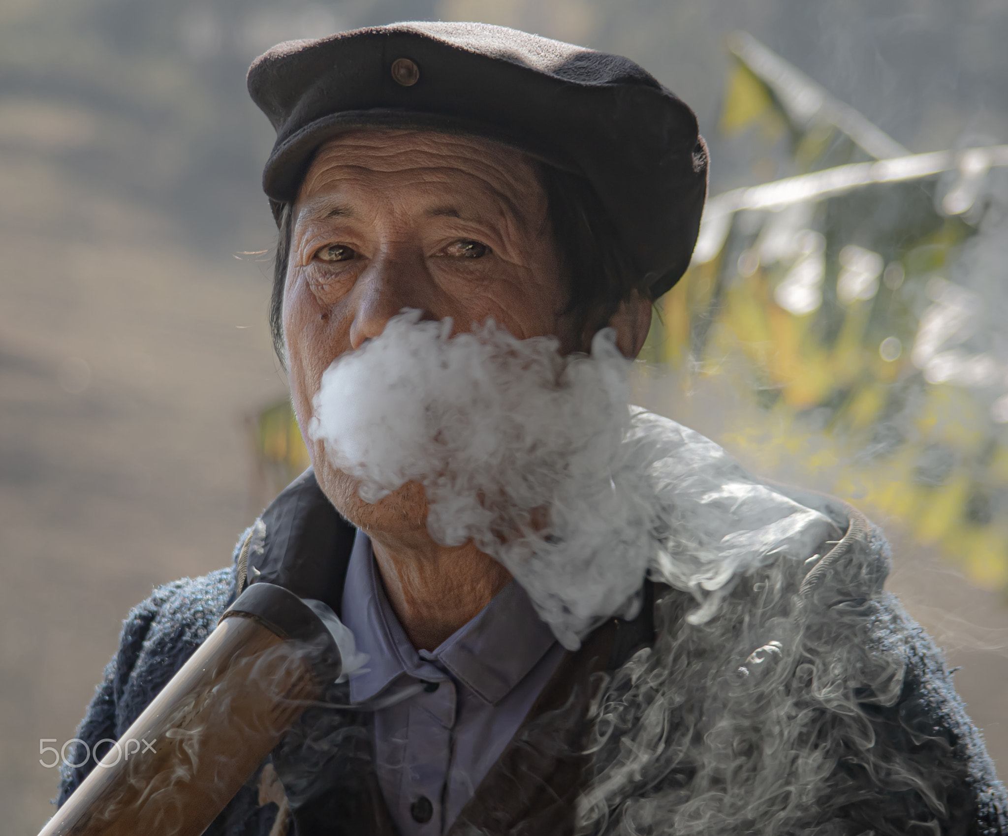 Man smoking “thuốc lào”