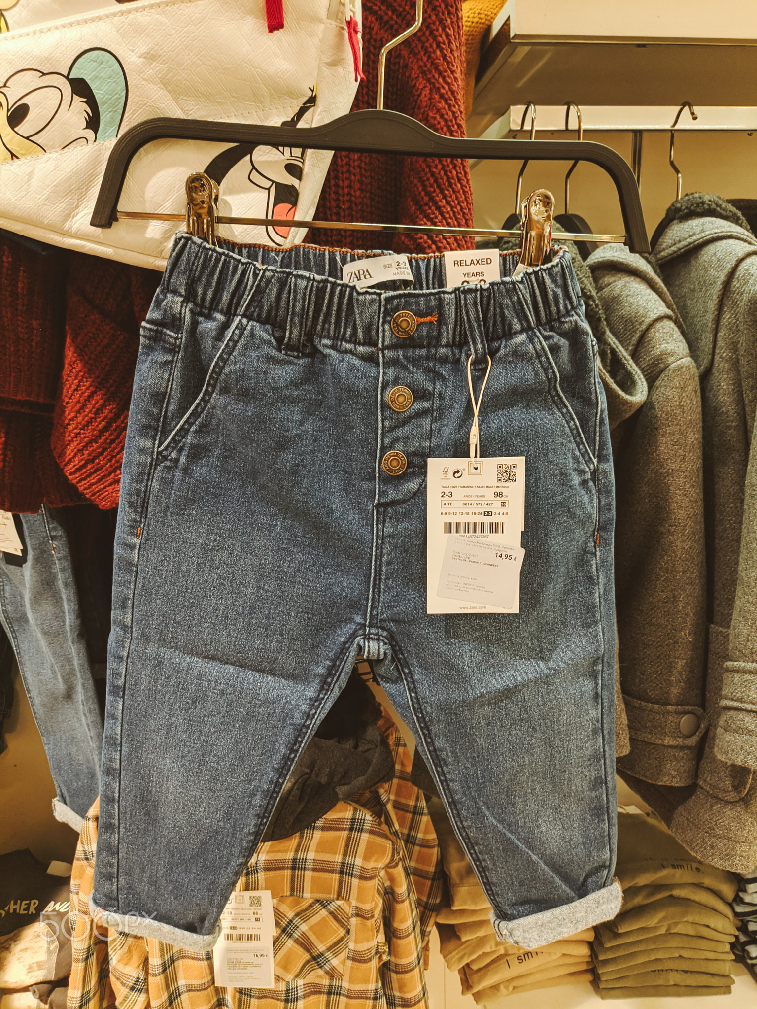 Budva, Montenegro - 01.08.22: Children jeans with a price tag on a
