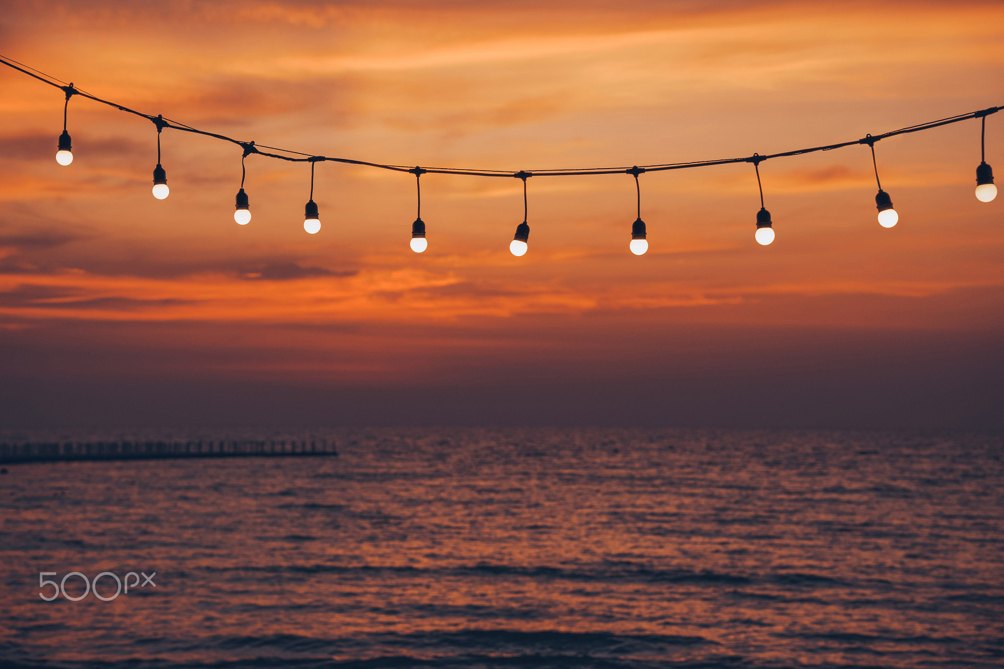 light bulb on the background of sea sunset