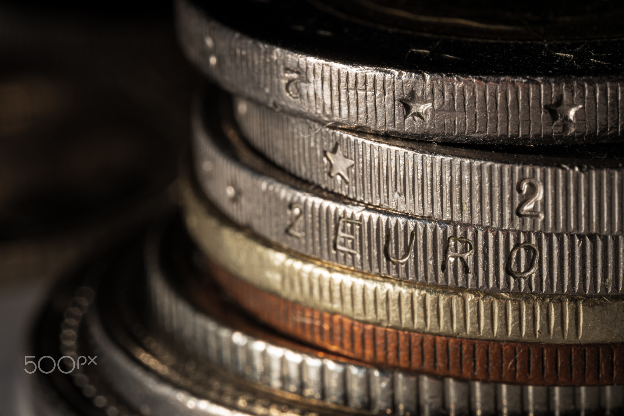 Stack of the coins and Two euro coin edge with soft focus