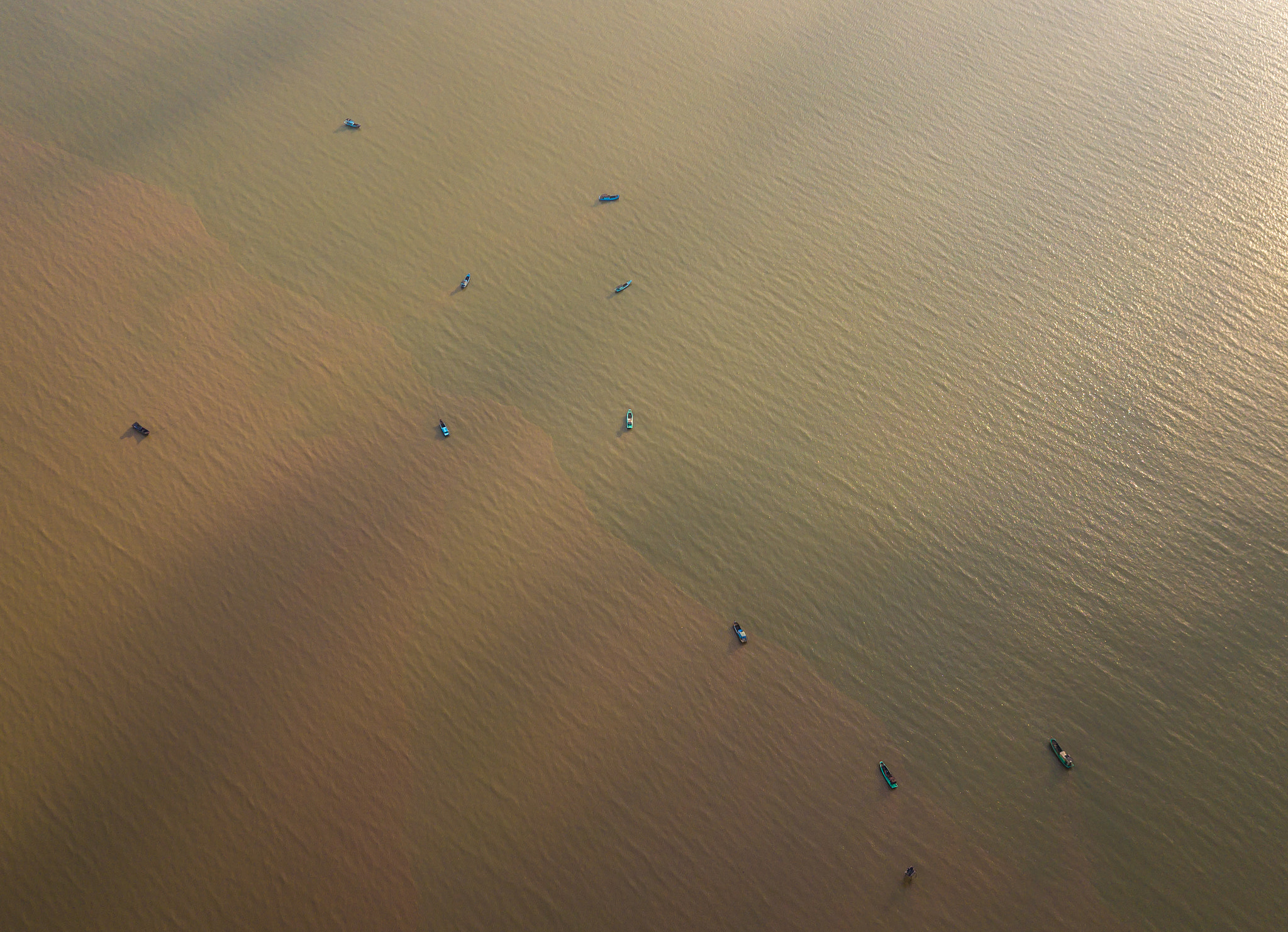 Abstract aerial photo of boats parked on the alluvial sea