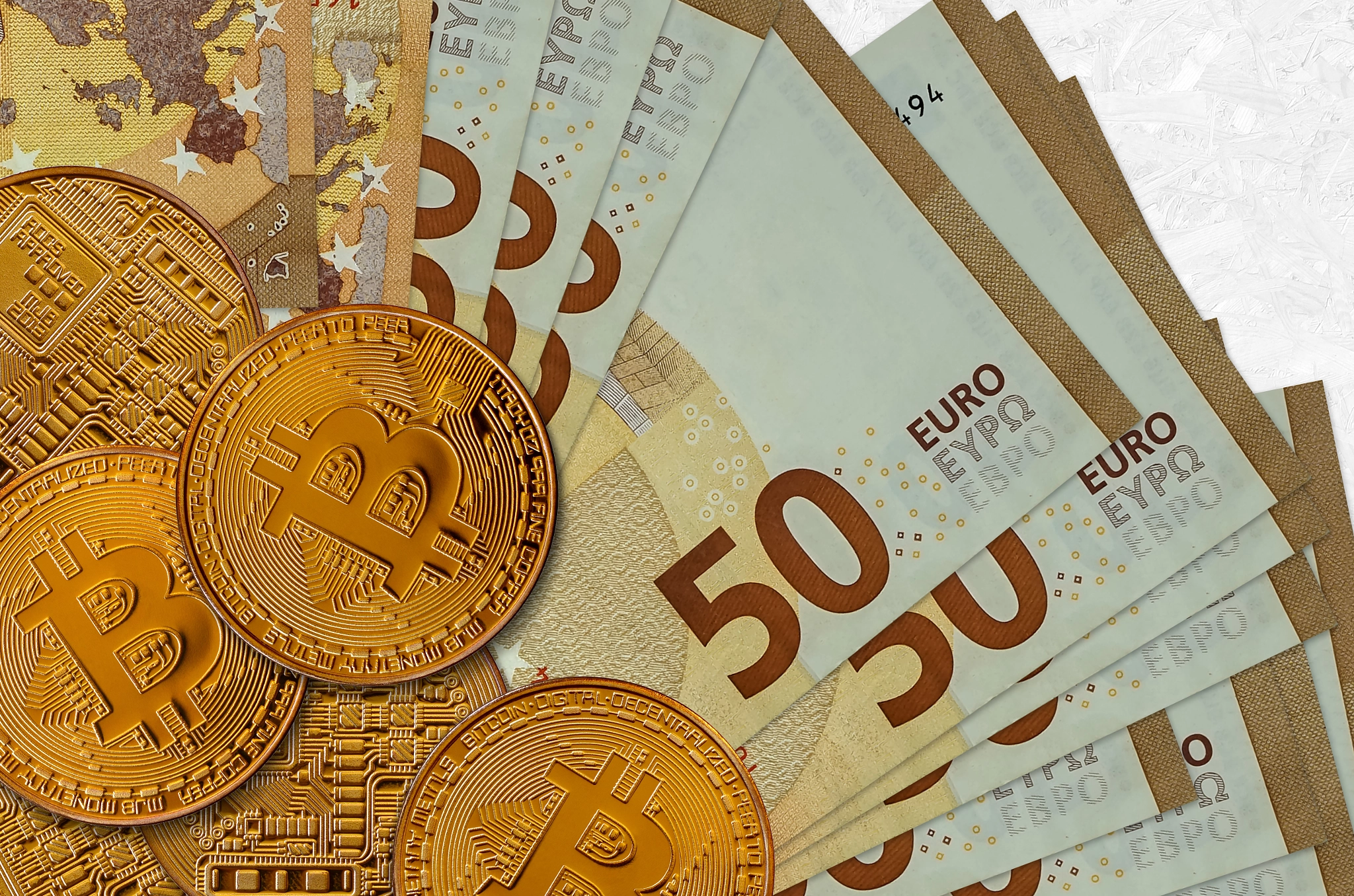 50 euro bills and golden bitcoins. Cryptocurrency investment concept. Crypto mining or trading