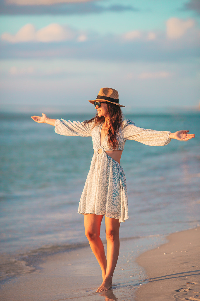 Young Happy Woman On The Beach Enjoy Her Summer Vacation At Sunset By Dmitrii Travnikov 500px 