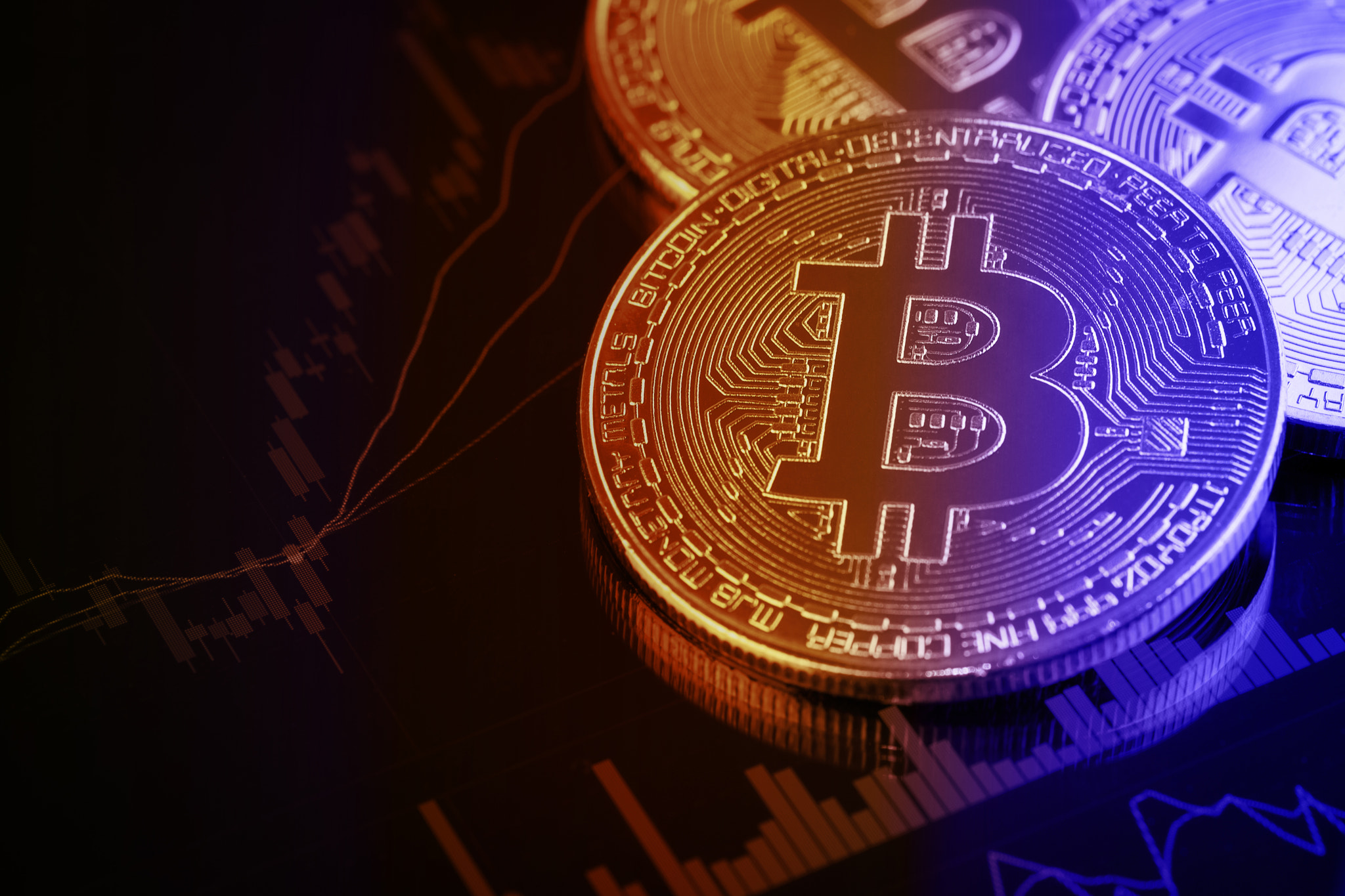 Bitcoins on investment money moving graph in background.Conceptual design for technology of Cryptocu