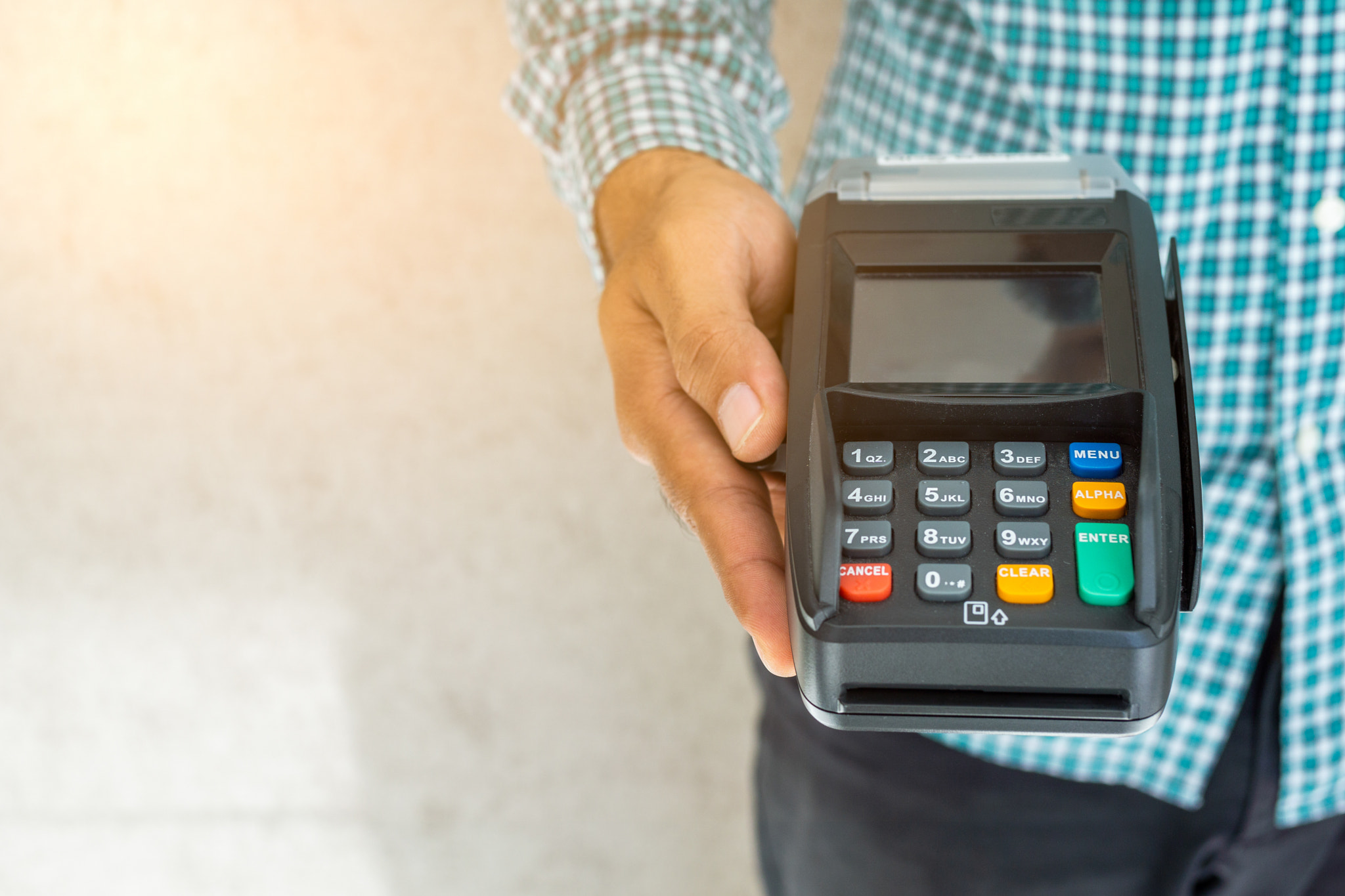 Hand man with credit card machine.