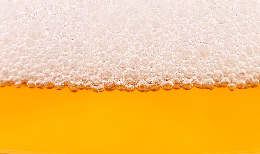 Closeup of beer and foam. by Oleg Begunenco on 500px.com