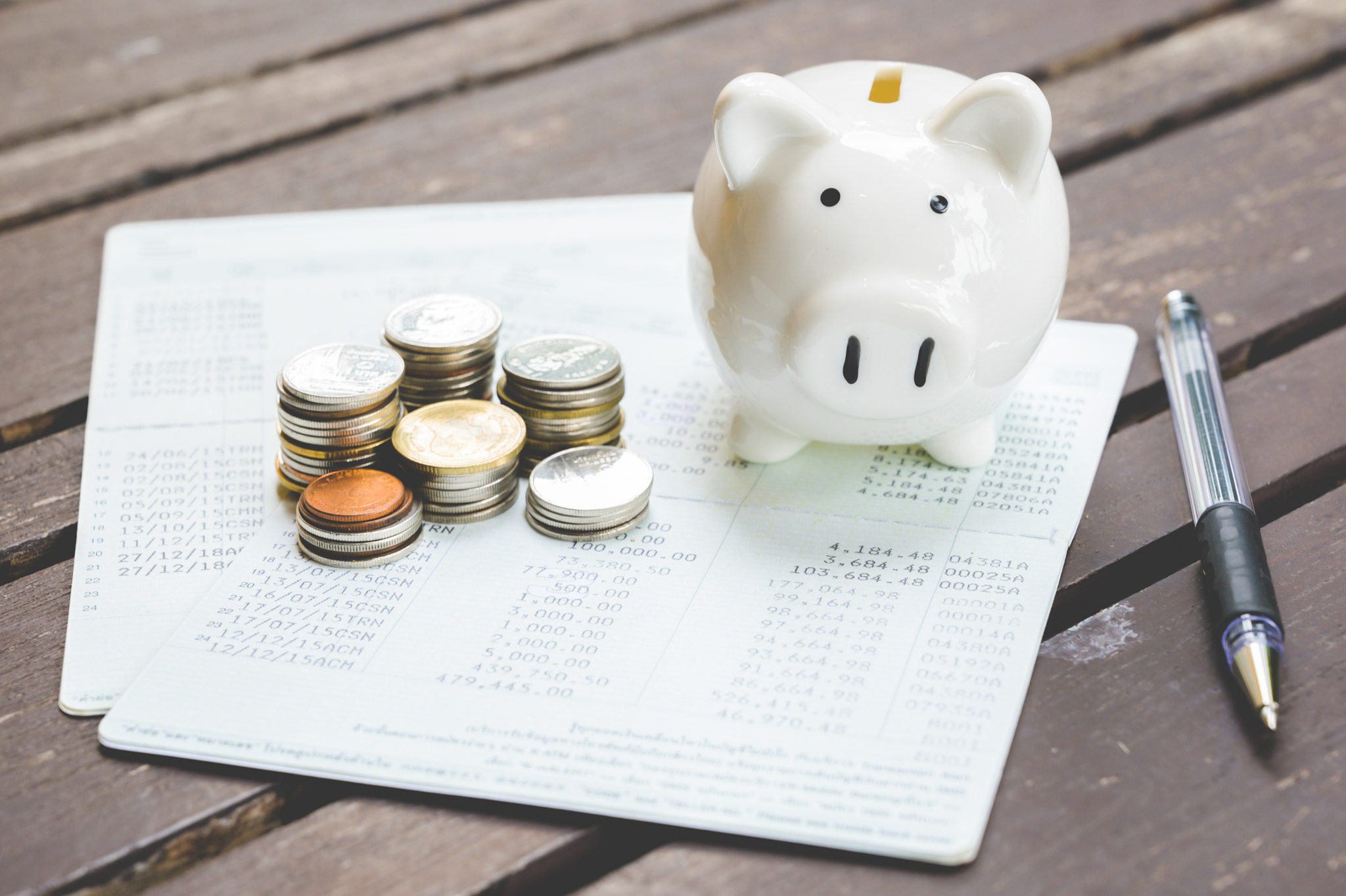 Piggy bank and stack of coin. Saving money concept.