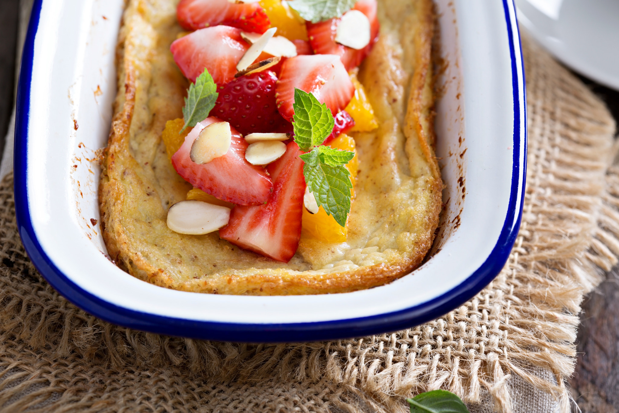 Baked pancake with oranges and strawberries