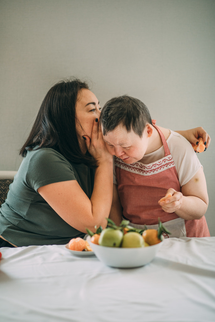 Lifestyle, education. An elderly woman with down syndrome is studying by Aiman Dairabaeva on 500px.com